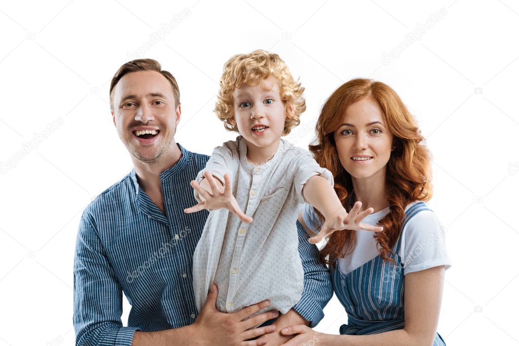 smiling caucasian family looking at camera