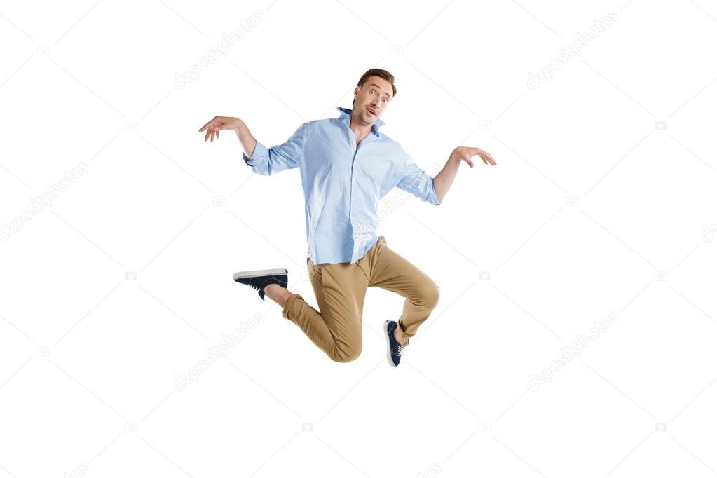 young man jumping with facial expression
