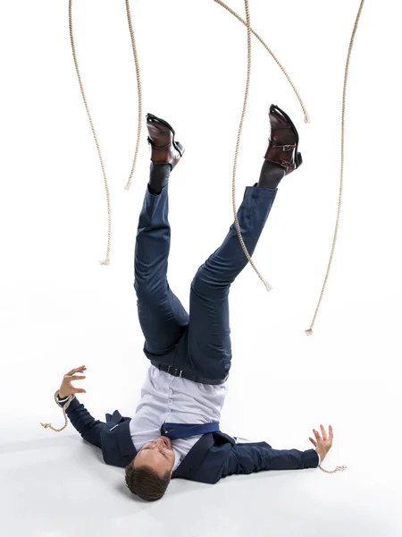 Businessman and manipulating ropes — Stock Photo