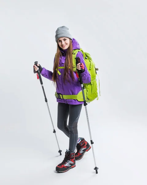 Glücklicher Wanderer mit Rucksack und Wanderausrüstung, isoliert auf grau — Stockfoto