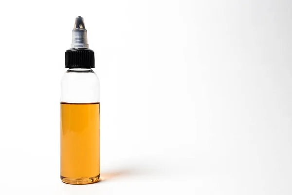 E- liquid, e-juice in the bottles isolated on the white background with copyspace — Stock Photo, Image