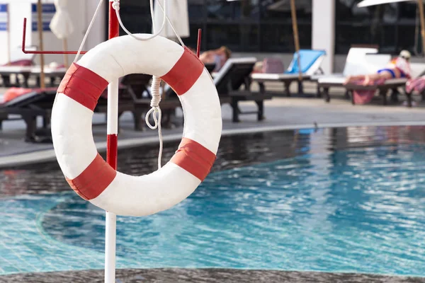 Red lifebuoy ring near the swimming pool. Rescue concept. — 스톡 사진