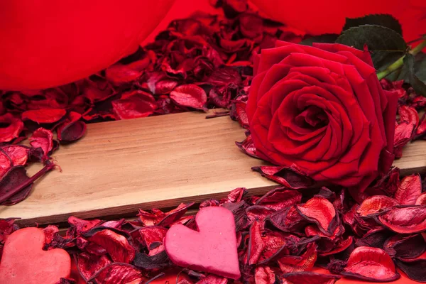 Red rose on wood