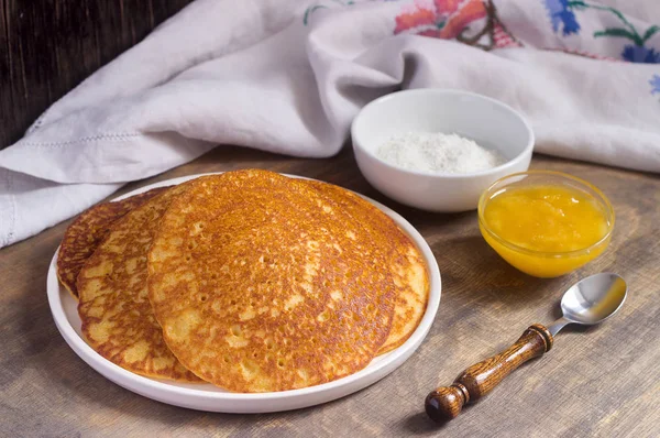 Coconut corn pancakes with honey. Rustic style.