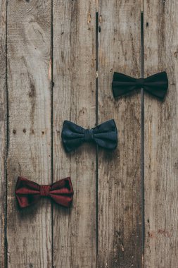 classic bow ties on wooden tabletop clipart
