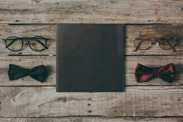eyeglasses and bow ties with coaster
