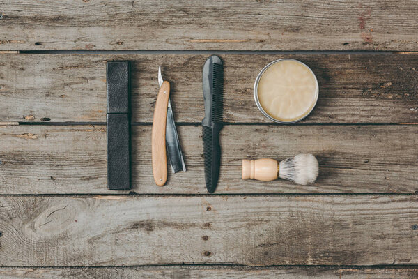 shaving equipment on wooden tabletop