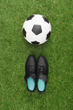 soccer ball with black boots clipart