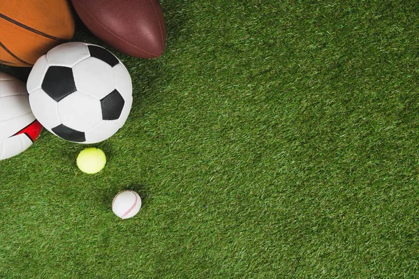 Balls on grass pitch — Stock Photo, Image