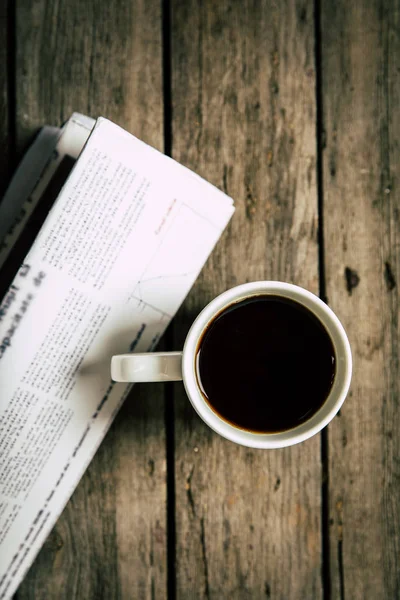 Cup of coffee and newspaper — Stock Photo, Image