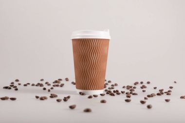 disposable cup with coffee grains clipart