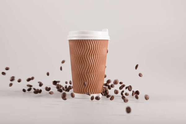 disposable cup with coffee grains