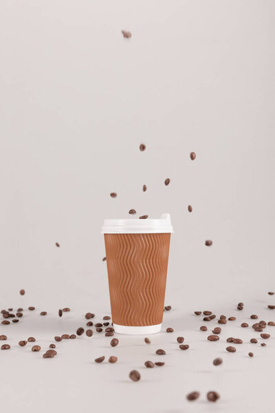 disposable cup with coffee grains