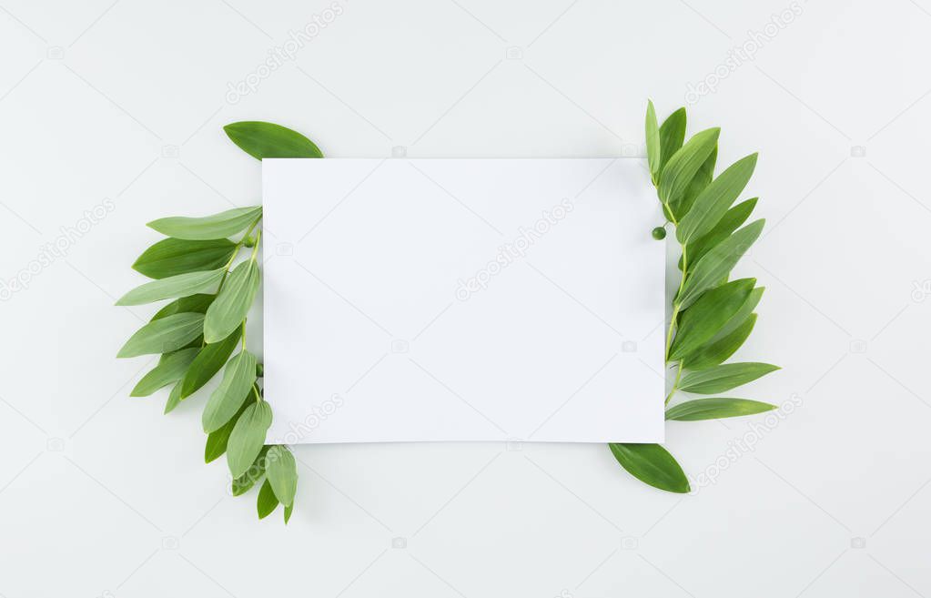 Blank card with green leaves