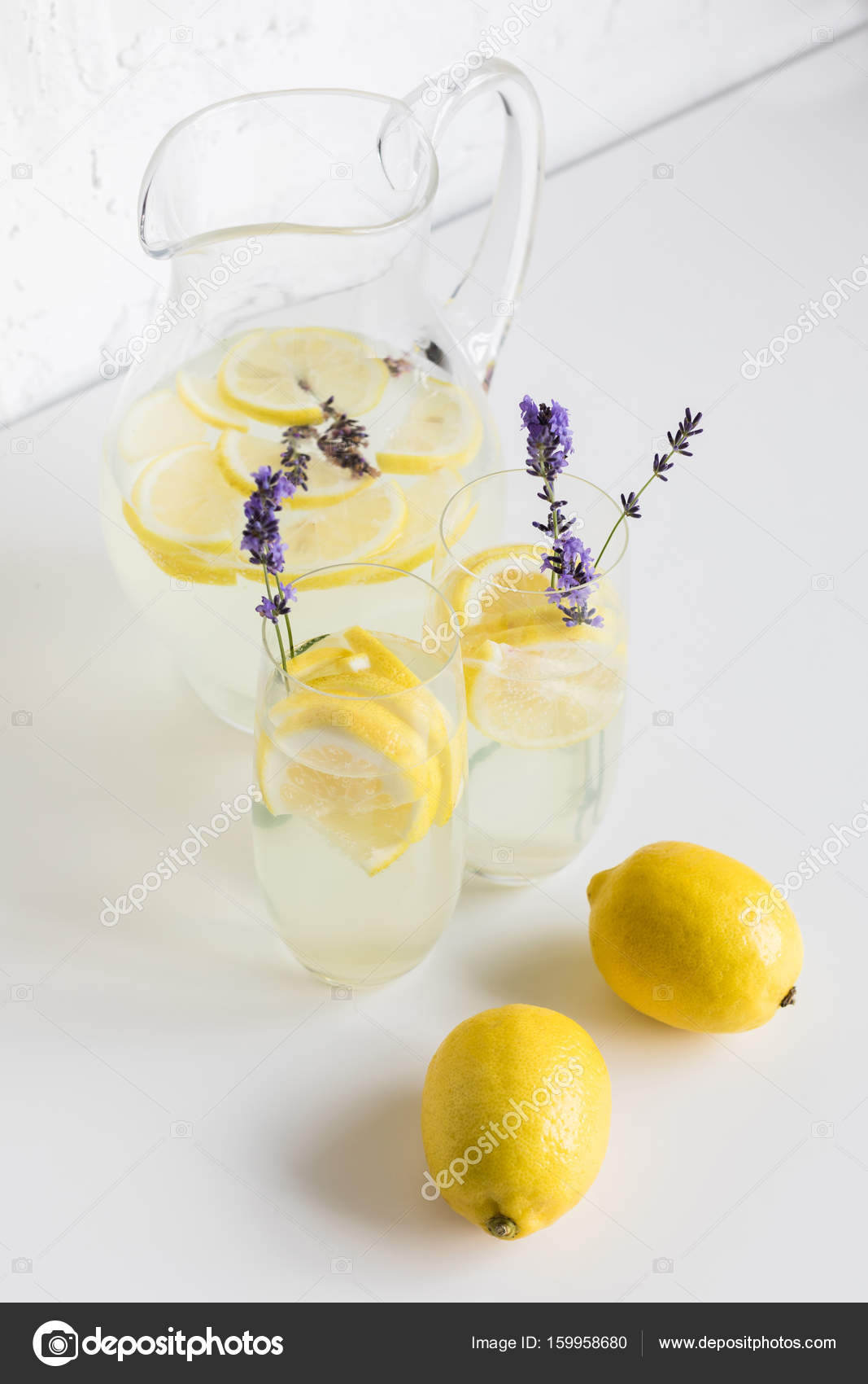 Lemonade in glasses and jar — Stock Photo © AntonMatyukha 159958680