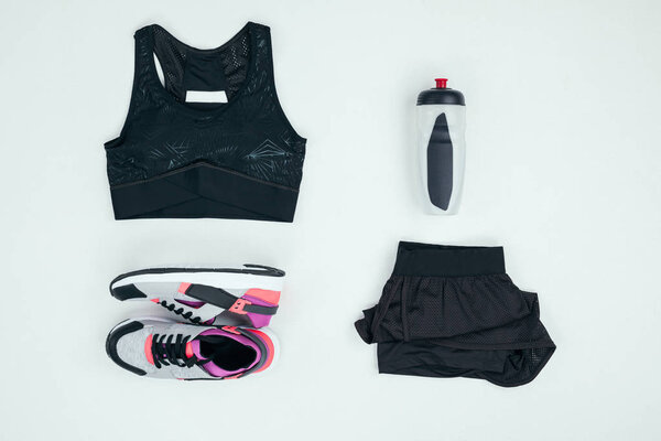 sportswear with sneakers and bottle 