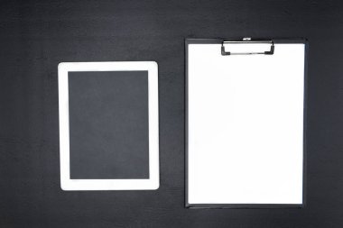 digital tablet and clipboard