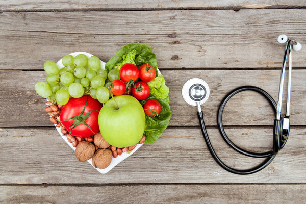 fresh vegetables, fruits and stethoscope