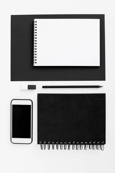 Smartphone, notepads and office supplies — Stock Photo, Image