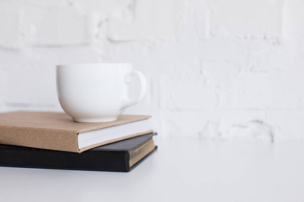 cup of coffee on books