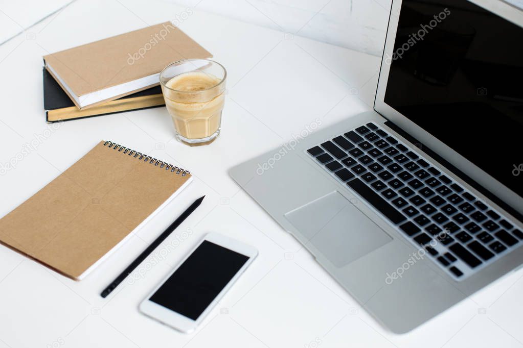 laptop, smartphone and notepad