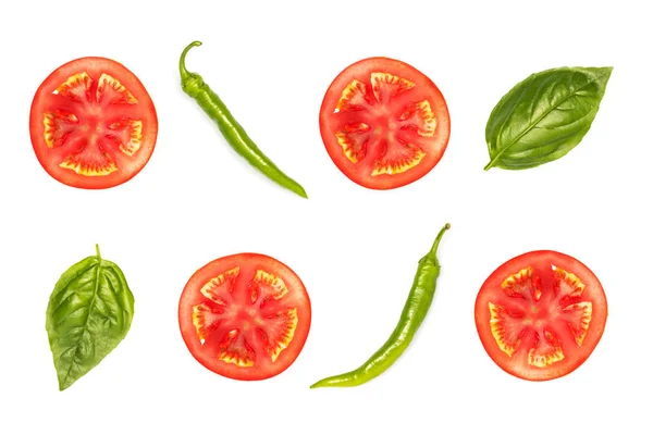 Slices of tomato with peppers and basil — Stock Photo, Image