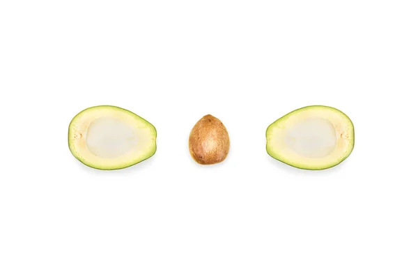 Halves of avocado and seed — Stock Photo, Image
