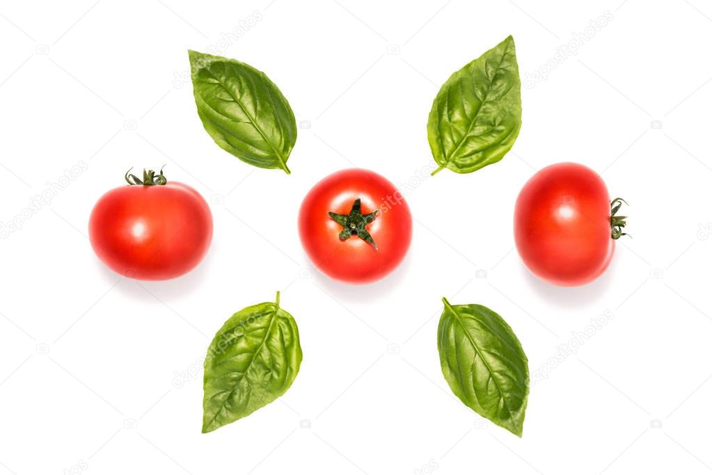 composition of tomatoes with basil leaves