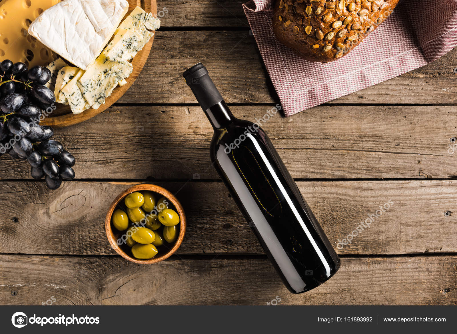 Wine, bread, olives and cheese Stock Photo by ©AntonMatyukha 161893992