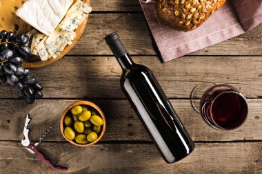 wine, bread, olives and cheese