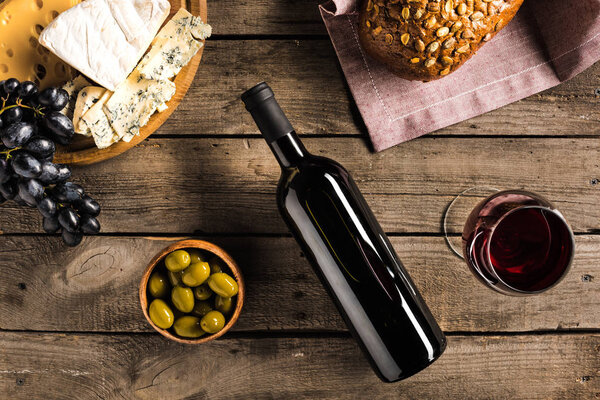 wine, bread, olives and cheese