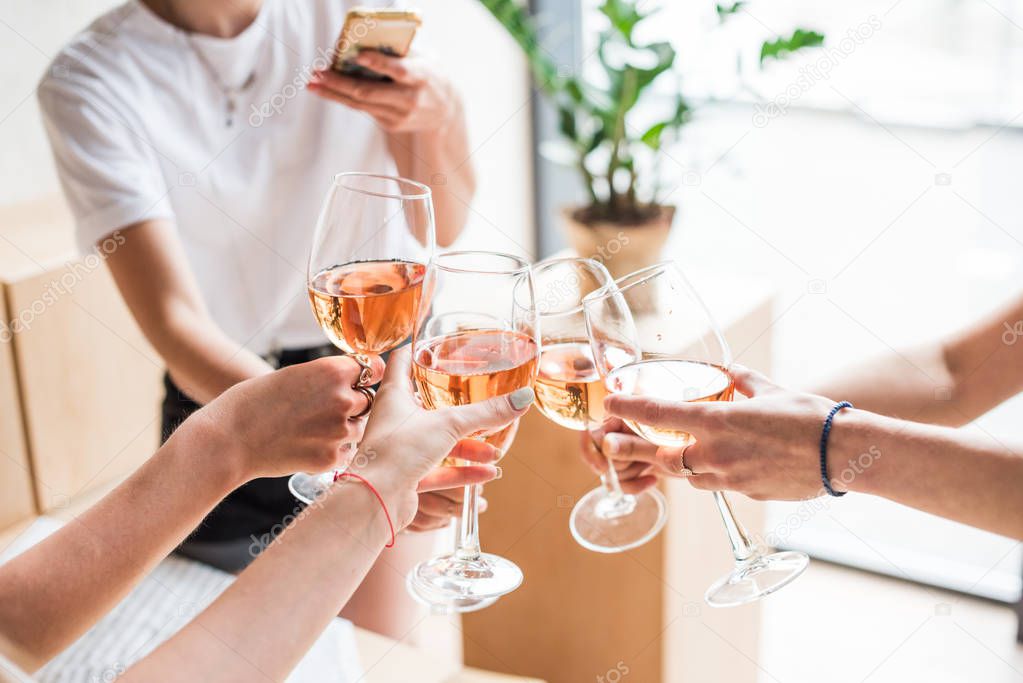 women clinking with wineglasses 