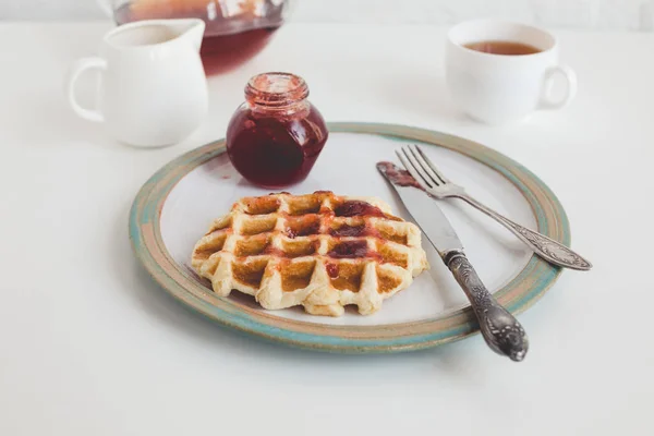 Waffle with jam on plate — Stock Photo, Image