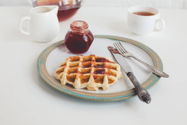 waffle with jam on plate