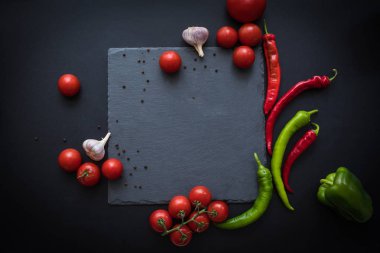 ripe vegetables and slate board