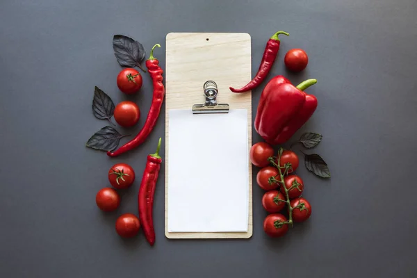 Peppers and blank paper sheet — Stock Photo, Image