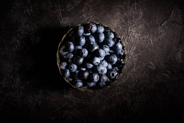 Blueberries in vintage bowl — Stock Photo, Image