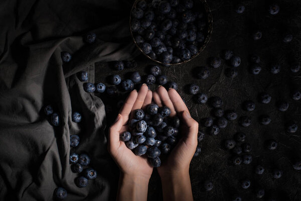 fresh blueberries in hands