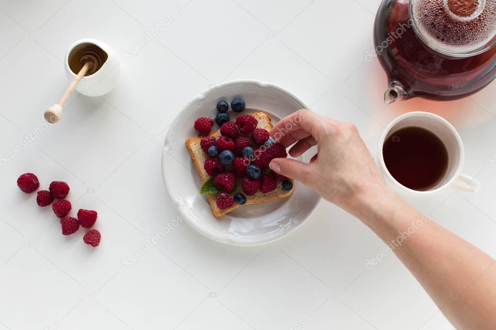 tea and toast with berries for breakfast