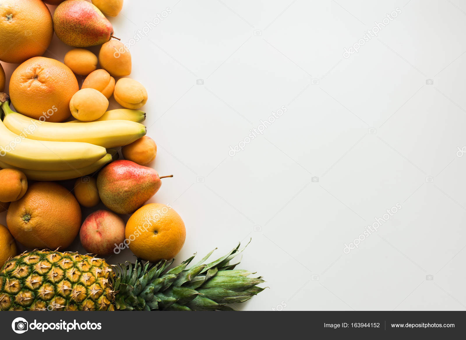 Different fresh fruits Stock Photo by ©AntonMatyukha 163944152