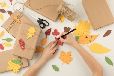 woman handcrafting autumn gifts clipart