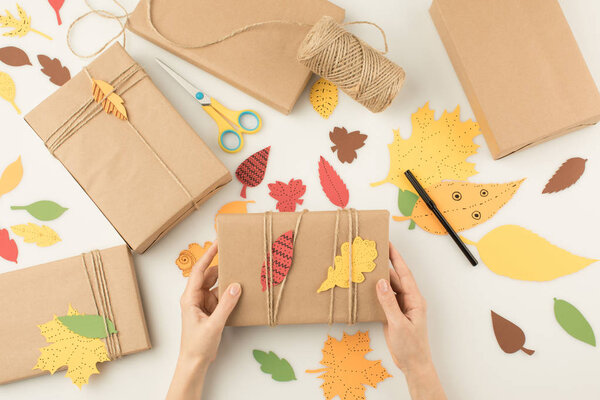 woman handcrafting autumn gifts