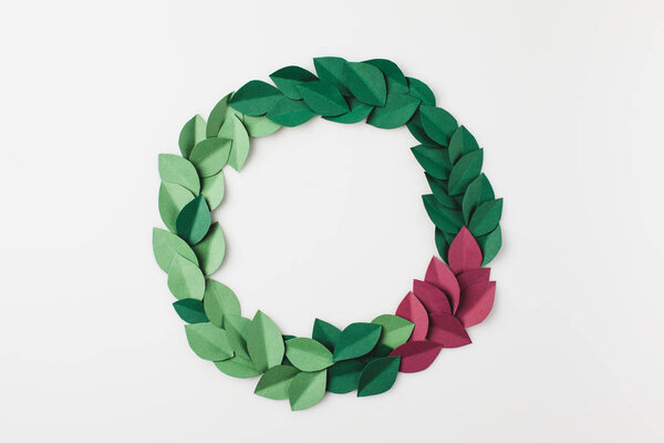 round frame of green paper leaves