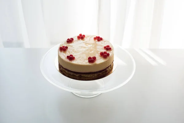 Cheesecake with berries on stand — Stock Photo, Image