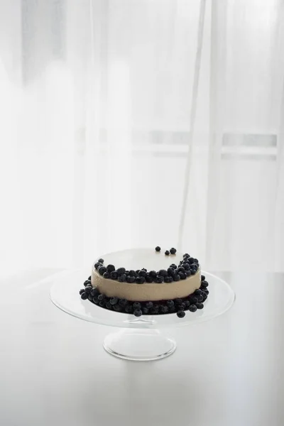 Cheesecake with blueberries on glass stand — Free Stock Photo