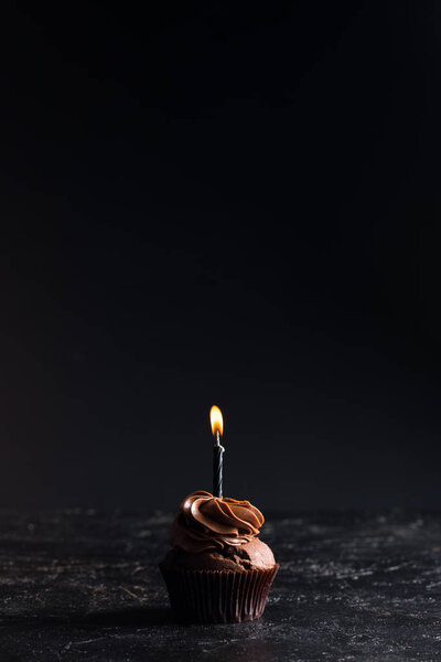 chocolate cupcake with candle