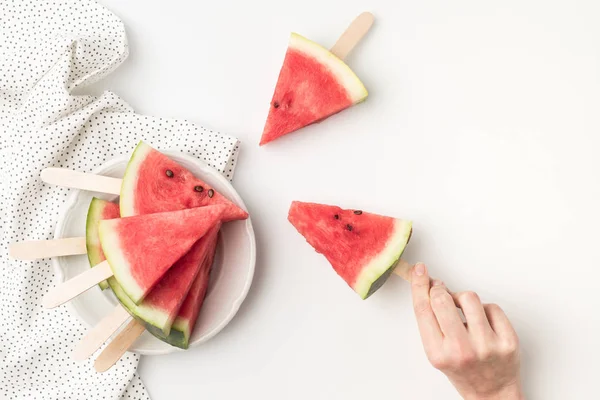 Watermelon slices on sticks — Stock Photo, Image