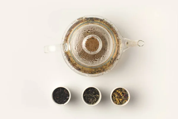 Herbal tea in glass teapot — Stock Photo, Image