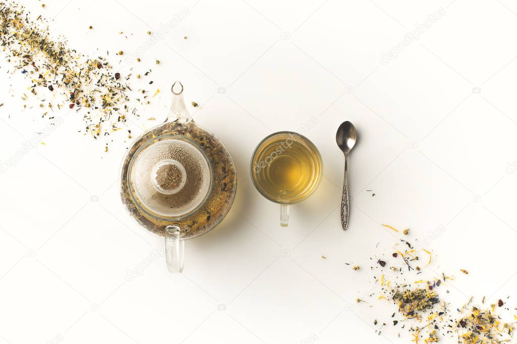 herbal tea in cup and kettle