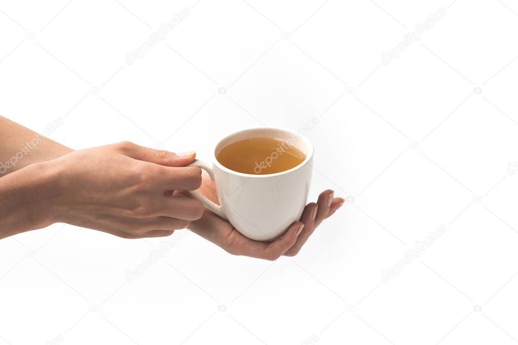 cup of herbal tea in hands